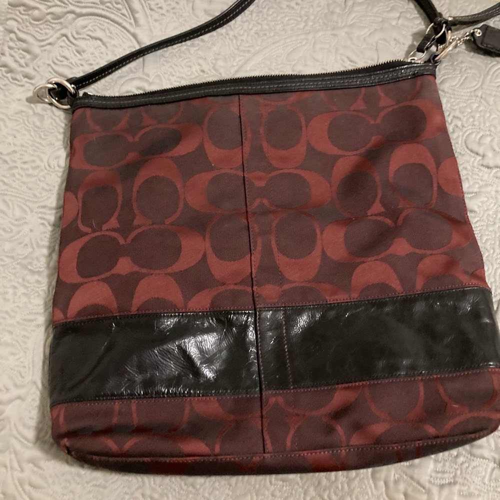 Coach signature handbag with black leather straps
